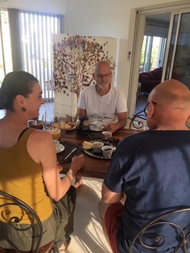 a group of people sitting around a table at lamaison-d'ose in Romans