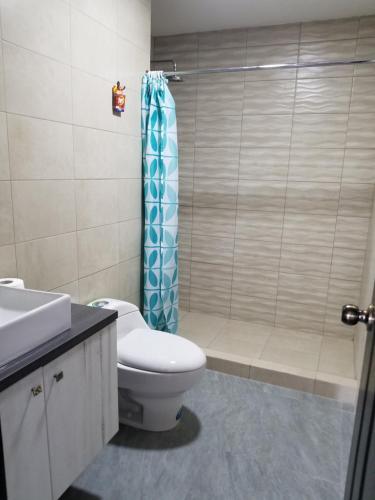 a bathroom with a toilet and a shower at Kattyapartament 303 Salinas in Salinas