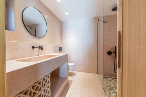 a bathroom with a sink and a mirror at Fillis House in Vourvourou