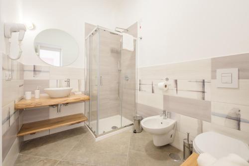 a bathroom with a shower and a toilet and a sink at Villa Caterina b&b in Procida
