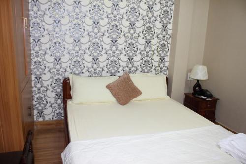 Postel nebo postele na pokoji v ubytování NGỌC MẤY - ĐẠI LỢI HOTEL