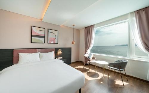 Postel nebo postele na pokoji v ubytování Hotel Hyggelig