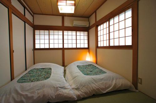 Voodi või voodid majutusasutuse Gion Rokudo toas