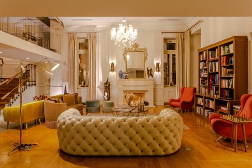a living room with a couch and a fireplace at Marpessa Hotel & Spa in Agrinion