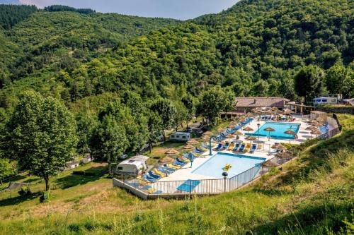 an aerial view of a resort with a swimming pool at Safaritent Glamping L'Ardechois in Gluiras