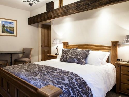 a bedroom with a large bed and a desk at Parkers House Bed & Breakfast in Newtown