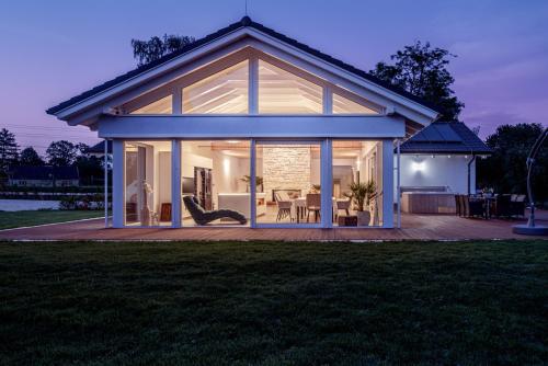a house with large glass doors on a patio at TERVEYS residence in Vělopolí