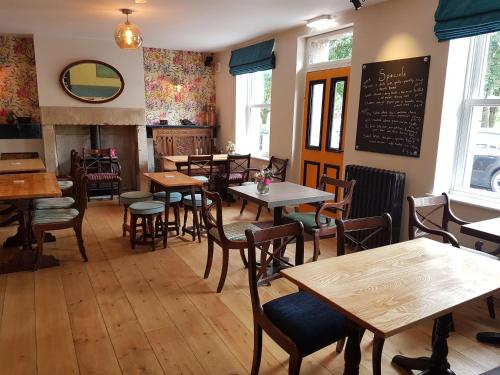 a classroom with tables, chairs, and tables in it at The Railway in Skipton