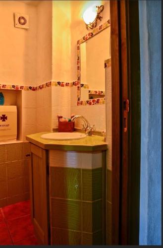 a bathroom with a sink and a mirror at Casaspa7 in Cortes de la Frontera
