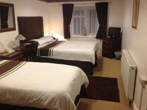 Katil atau katil-katil dalam bilik di Richmond Hotel