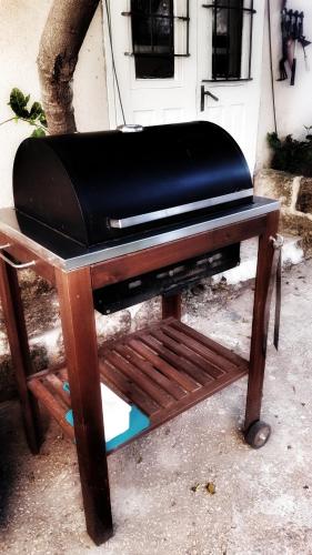 a toaster oven sitting on top of a wooden table at 19th Century Magical House in Galilee in ‘Eilabūn