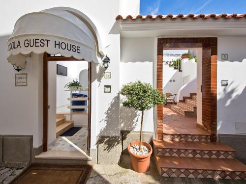 a guest house with a potted plant in front of it at San Nicola Guest House in Anacapri