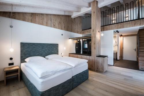 Ein Bett oder Betten in einem Zimmer der Unterkunft Hotel Ciasa Tamá