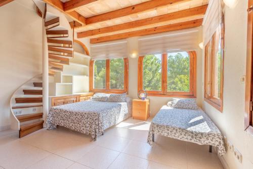 Postel nebo postele na pokoji v ubytování Villa Costa De Blanes
