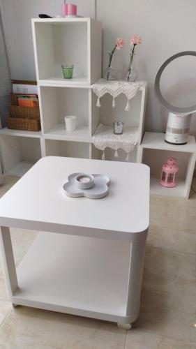 a white table with a mirror and a shelf at Bara Blanc Beach in Roda de Bará