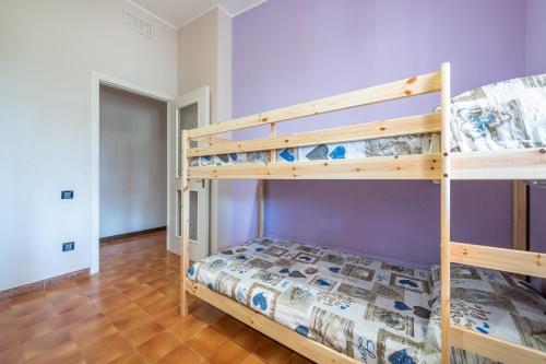 a bedroom with two bunk beds in a room at Villa Serra in Quartu SantʼElena