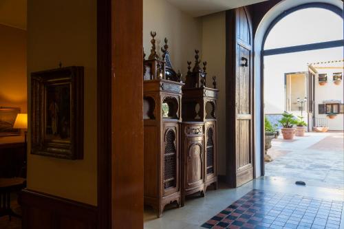 an entrance to a building with an open door at Hotel Foresteria Baglio Della Luna in San Leone
