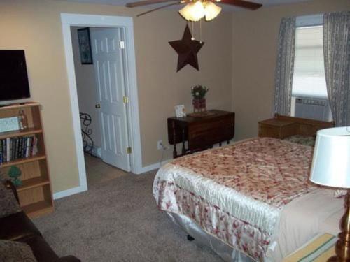 a bedroom with a bed and a star on the wall at Tin Brook Bed & Breakfast in Walden