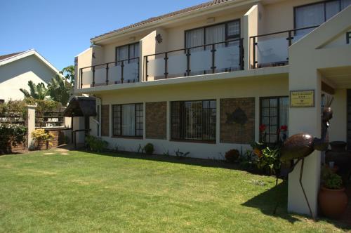 a house with a lawn in front of it at Crowned Crane in Gonubie