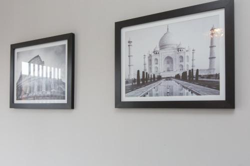 two framed photographs of the taj mahal at Townhouse @ Electricity Street Crewe in Crewe