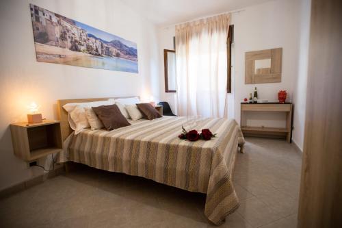 a bedroom with a large bed with flowers on it at La casa di Nana’ locazione turistica in Palermo