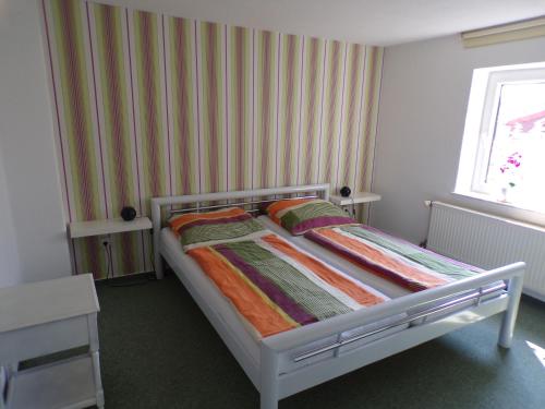 
Ein Bett oder Betten in einem Zimmer der Unterkunft Ferienwohnung am Greifswalder Bodden
