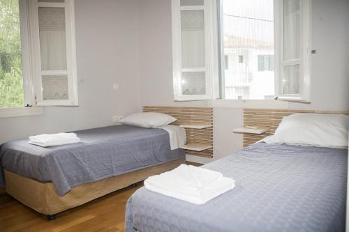 En eller flere senge i et værelse på Villa Damiani