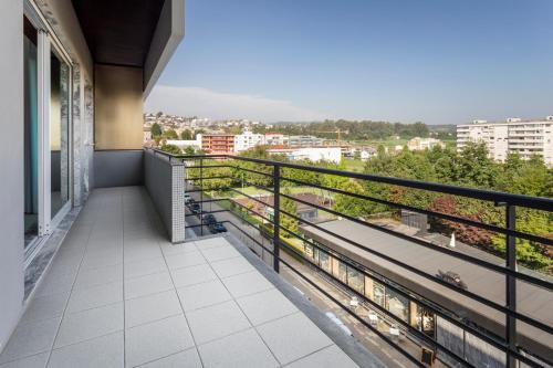 a balcony with a view of a city at B&B HOTEL e Apartamentos Felgueiras in Felgueiras
