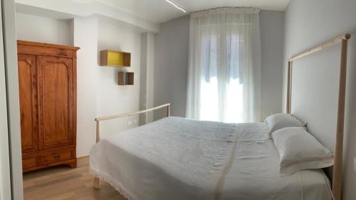 เตียงในห้องที่ Casa Ludovica