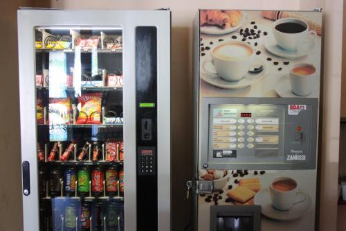 a vending machine with coffee and drinks in it at Hôtel Quick Palace Valence Nord in Bourg-lès-Valence
