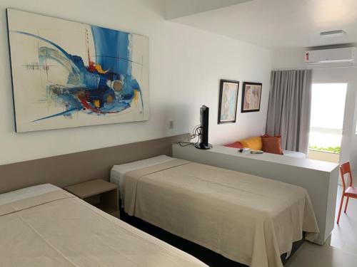 Ένα ή περισσότερα κρεβάτια σε δωμάτιο στο Bahia Flat - Barra