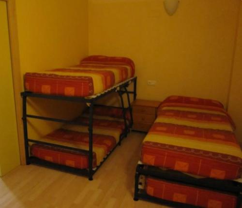 En eller flere senge i et værelse på Apartamentos turísticos Isín