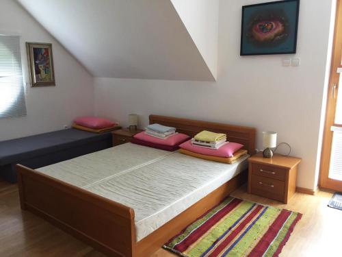a bedroom with two beds in a room at Apartmán TRIGA in Snina
