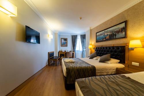 Postel nebo postele na pokoji v ubytování Levent Hotel Istanbul