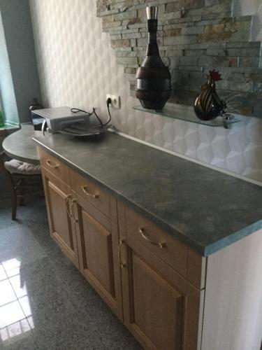 a kitchen with a counter top and a sink at Appartement Wissembourg hyper centre in Wissembourg