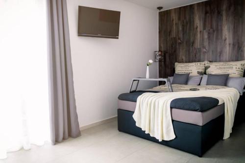 Katil atau katil-katil dalam bilik di Life ATMOsphäre Apartment Lahr-Schwarzwald