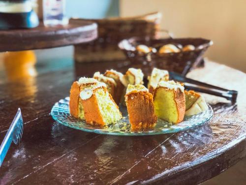 a plate of cakes sitting on a table at Chalés JL in Capitólio