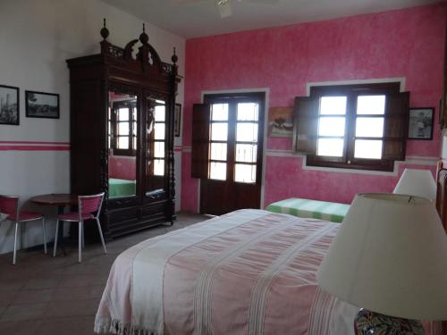 Un pat sau paturi într-o cameră la Hacienda Santa Clara, Morelos, Tenango, Jantetelco
