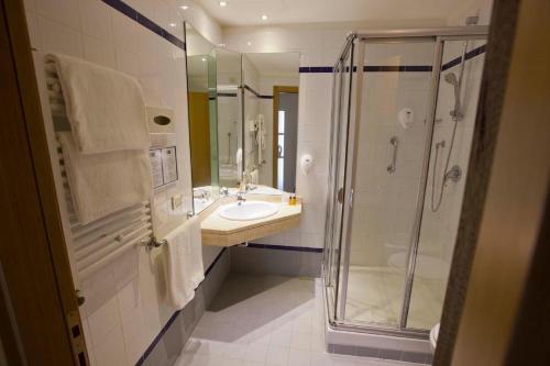 a bathroom with a shower and a sink and a showerspective at GP Hotel in Rome