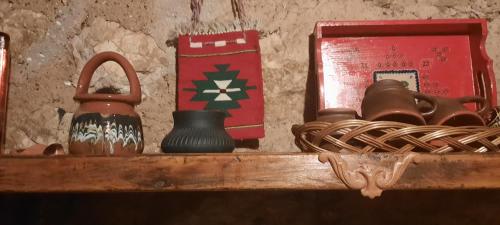 a shelf with a jug and other items on it at Golemi kamik Pirot in Pirot