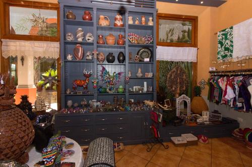 a room with a blue cabinet filled with lots of items at Hotel Boutique Casa San Angel in Mérida
