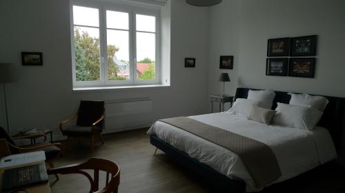 Кровать или кровати в номере Maison d'hôtes Le 90