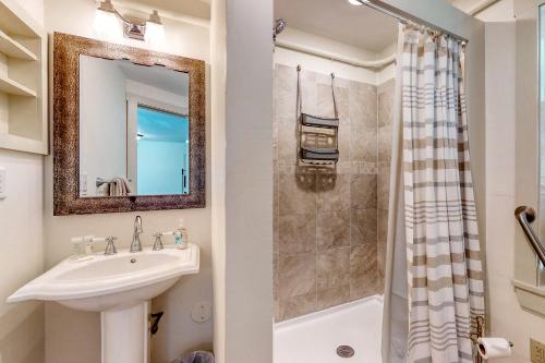 a bathroom with a sink and a shower at Sheepscot Beauty in Wiscasset