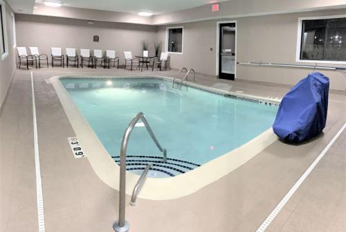 a large swimming pool in a hospital at Baymont by Wyndham Paw Paw in Paw Paw