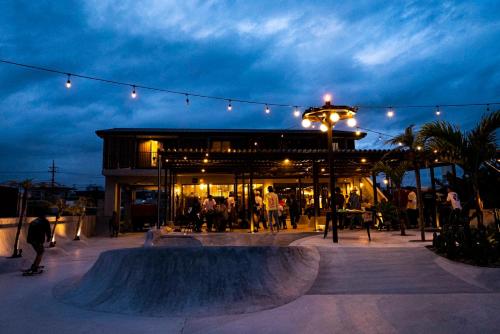 a skate park with a skateboard ramp in front of a building at MARINX CLASSIC HARBORVIEW PENSION in Yaese
