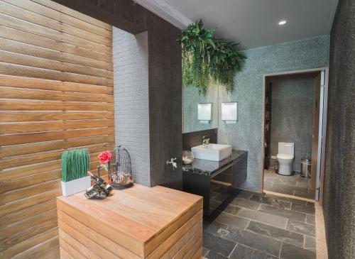 a bathroom with a sink and a toilet at Royal Rose Hotel Xinsheng in Taipei