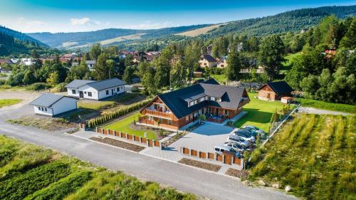 an aerial view of a house with a yard at Apartmány Roháče in Zuberec