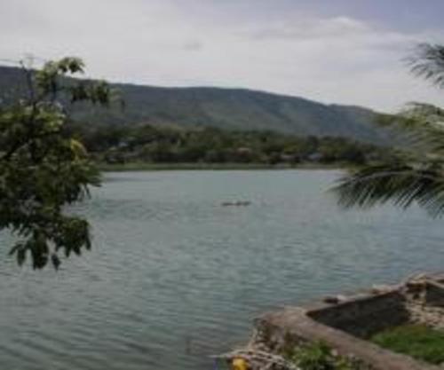 a large body of water with mountains in the background at Laster Jony's in Tuk Tuk
