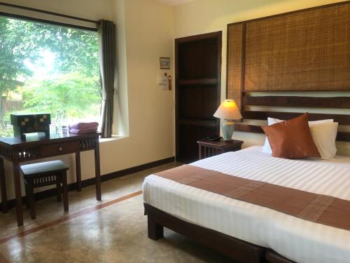 Baan Krating Pai Resort - SHA Plus tesisinde bir odada yatak veya yataklar