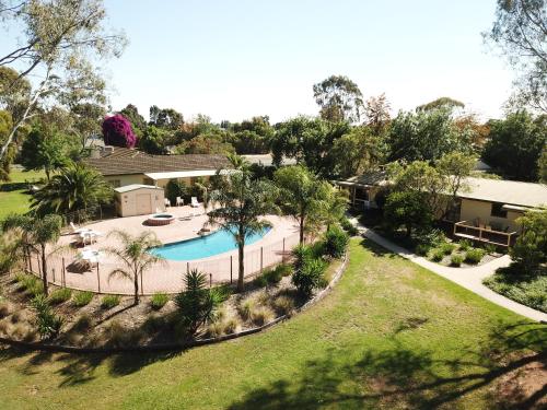 an aerial view of a house with a swimming pool at Winbi River Resort Holiday Rentals in Moama
